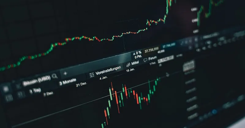 Close-up of a digital market analysis display showing Bitcoin and cryptocurrency price trends.